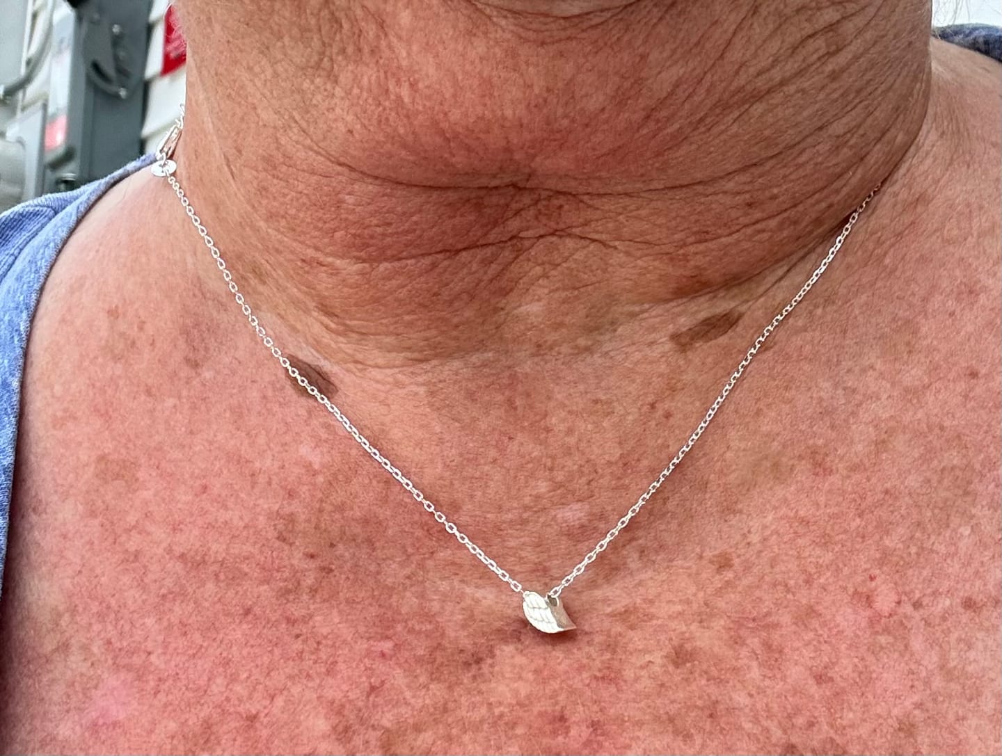 Customer photo review of always near angel wing necklace
