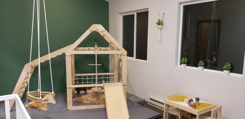 Customer photo review of Indoor Wooden Playhouse with Triangle ladder, Slide Board and Swings