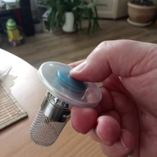 Customer photo review of Bouchon lavabo avec panier filtrant