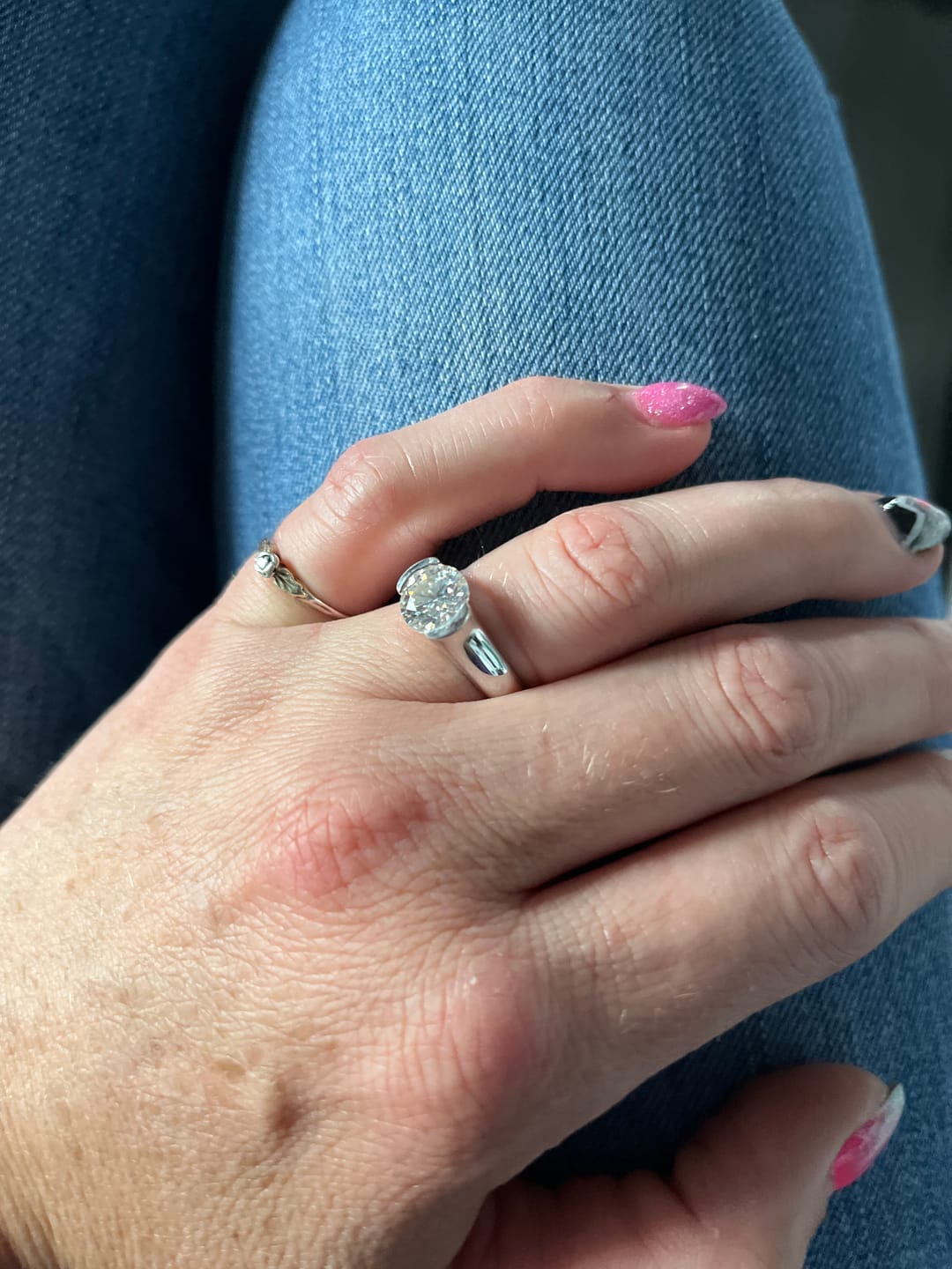 Customer photo review of Solitaire Moissanite Half Bezel Set Sterling Silver Engagement Ring