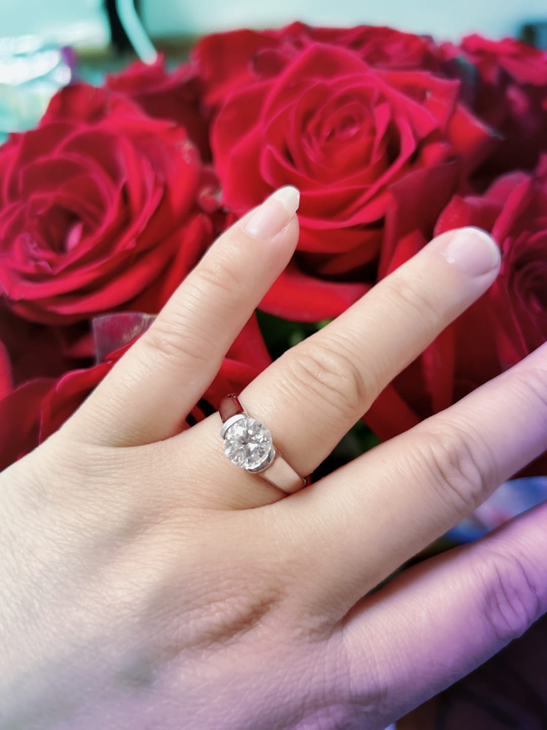 Customer photo review of Solitaire Moissanite Half Bezel Set Sterling Silver Engagement Ring