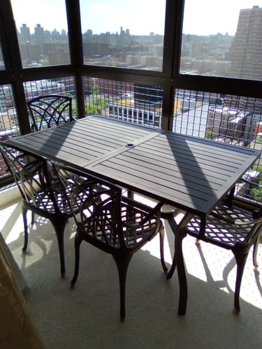 Customer photo review of EROMMY 60'' Outdoor Dining Table for 6, E-Coating Metal Patio Dining Table with 1.57''~1.9'' Adjustable Umbrella Hole, All-Weather Resistant Rectangular Table