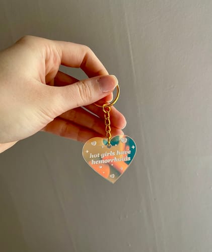 Customer photo review of Hot Girls Have Hemorrhoids Iridescent Acrylic Keychain