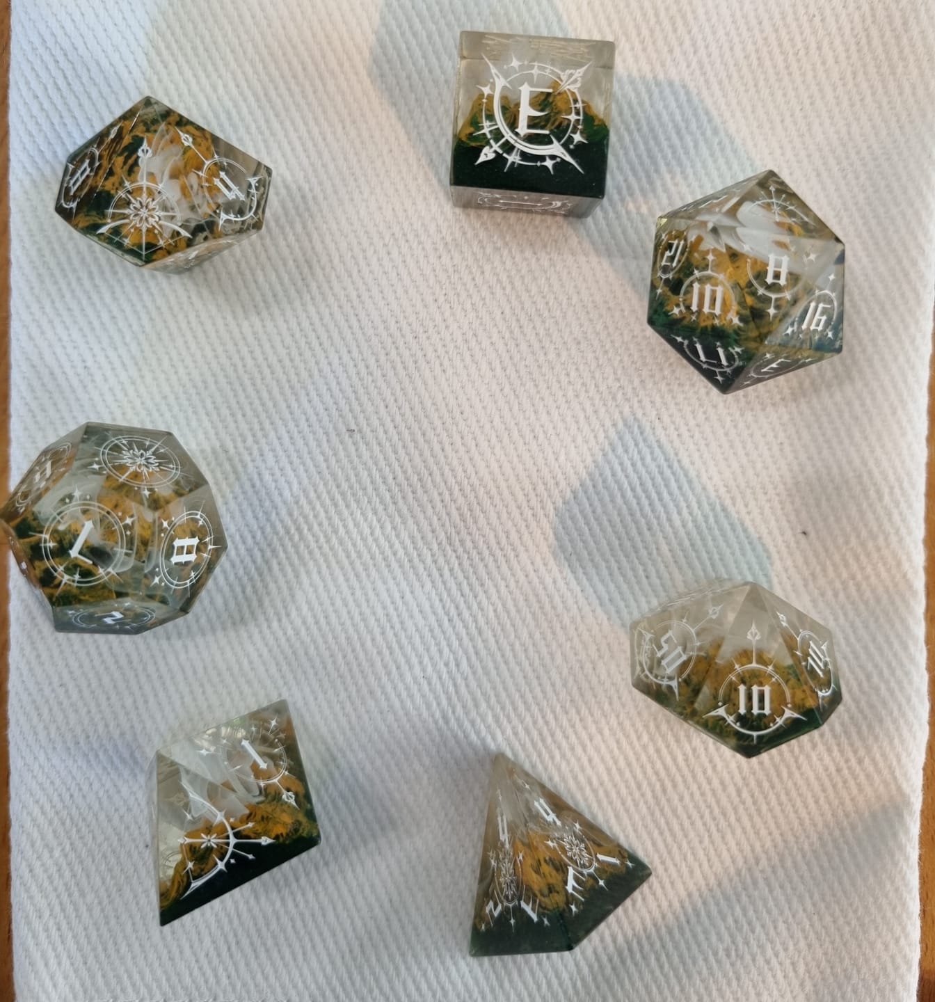 Customer photo review of URWizards D&D Resin Engraved Dice Set Mysterious Realm - Rocky Mountains Bow of Elven