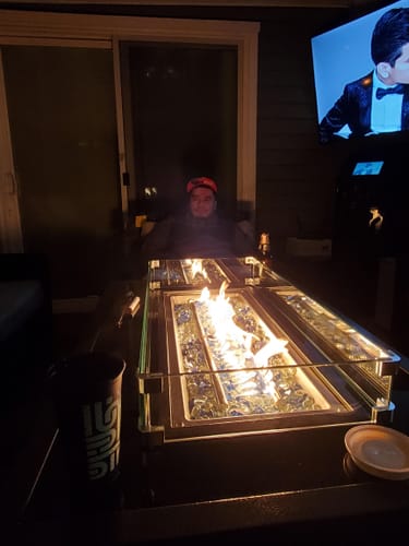 Customer photo review of 44 in Outdoor Propane Gas Fire Pit Table with Glass Wind Guard, Dark Brown