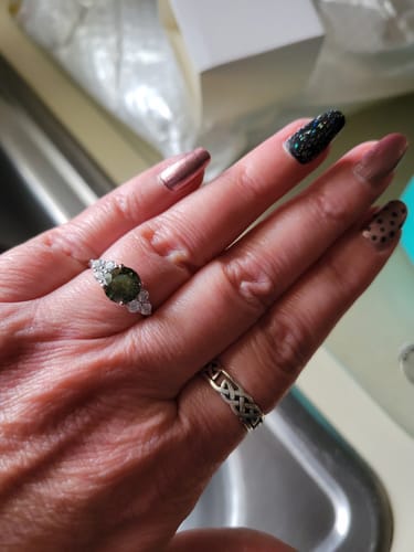 Customer photo review of Green Moissanite Side Stone Engagement Ring