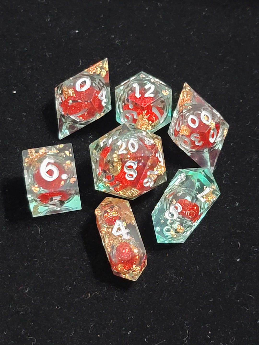 Customer photo review of Red And Gold Glitter Liquid Core Handmade Resin DND Dice Set