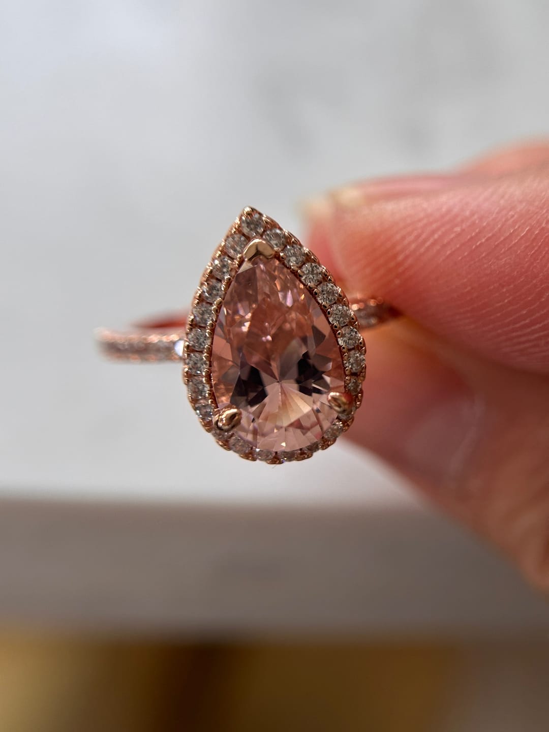 Customer photo review of Louily Rose Gold Halo Pear Cut Synthetic Morganite Engagement Ring