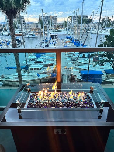 Customer photo review of 44 in Outdoor Propane Gas Fire Pit Table with Glass Wind Guard, Dark Brown