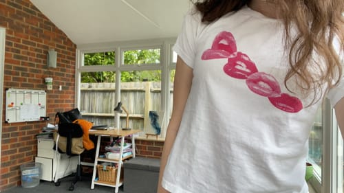 Customer photo review of 'Give Me A Kiss' baby tee