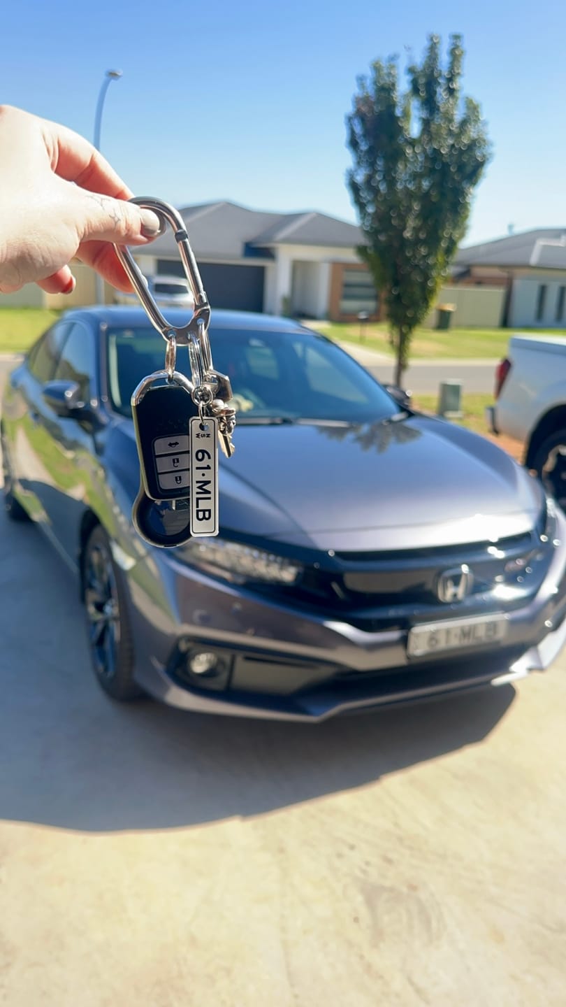 Customer photo review of NSW Colour on White Licence Plate Custom Keychain