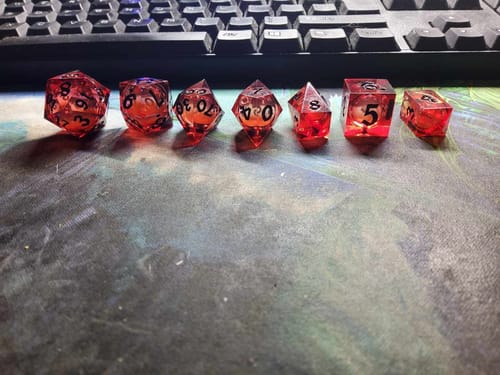 Customer photo review of Blood Red Glitter Liquid Core Handmade Resin DND Dice Set