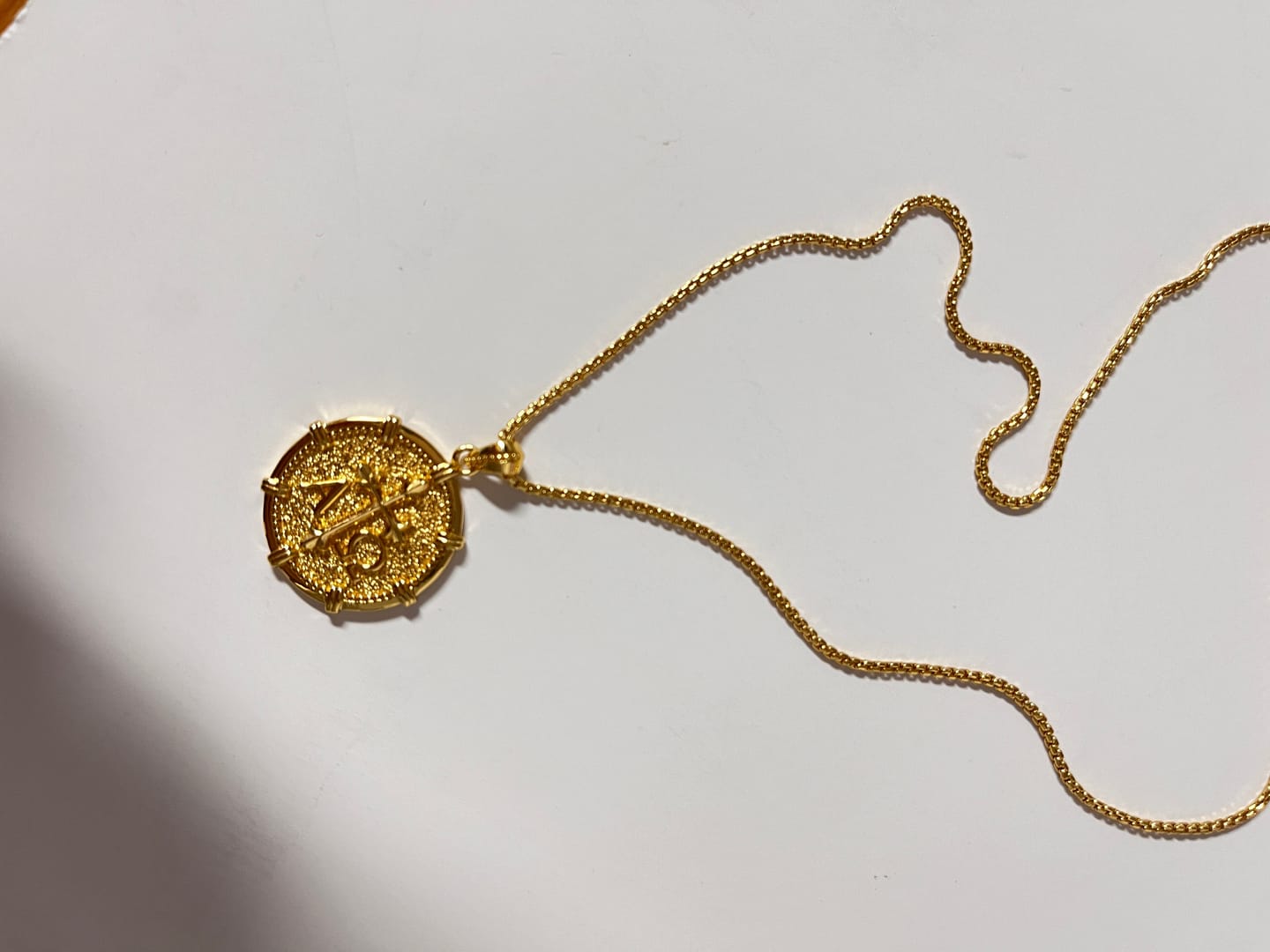 Customer photo review of Alpha Omega Fleur-de-Lis Cross Medallion Necklace