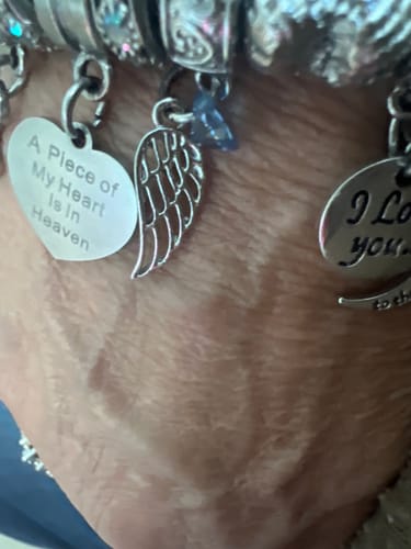 Customer photo review of "Angel Wing" with Blue gem Clip-on Charm
