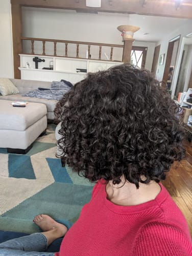 Customer photo review of Neutral Dark Brown Curly Clip-In Hair Extensions