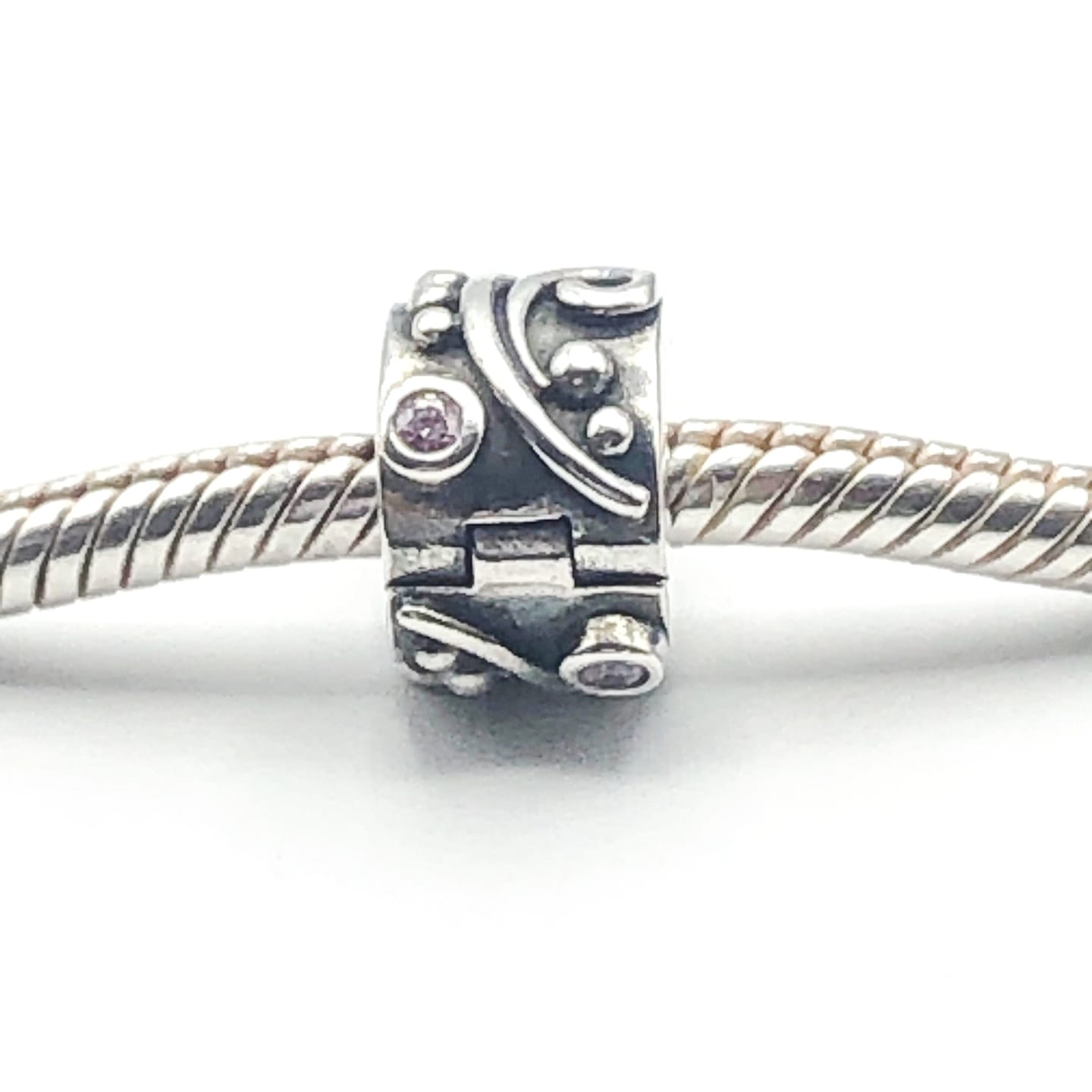 Customer photo review of PANDORA Pink Tendril 925 ALE Sterling Silver Clip Charm With Pink Cubic Zirconia 790380PCZ - Retired