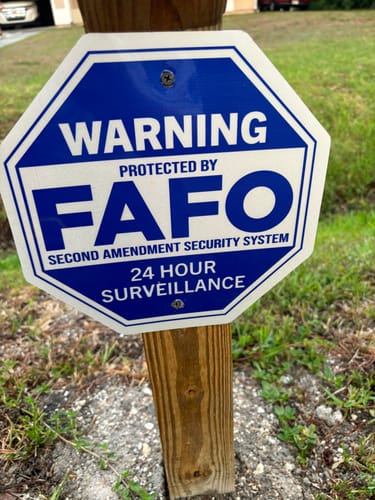 Customer photo review of Warning Protected FAFO Security Garage Sign