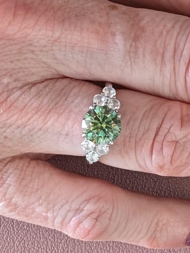 Customer photo review of Green Moissanite Side Stone Engagement Ring