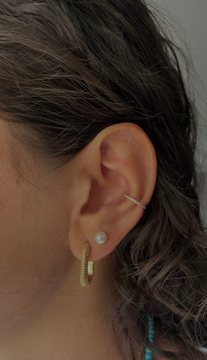 Customer photo review of Conch Clicker | Titan Piercing