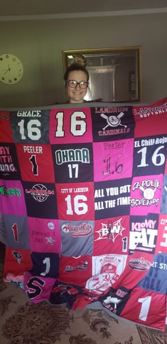 T-shirt quilt with sports, community events themes by Sara from SC