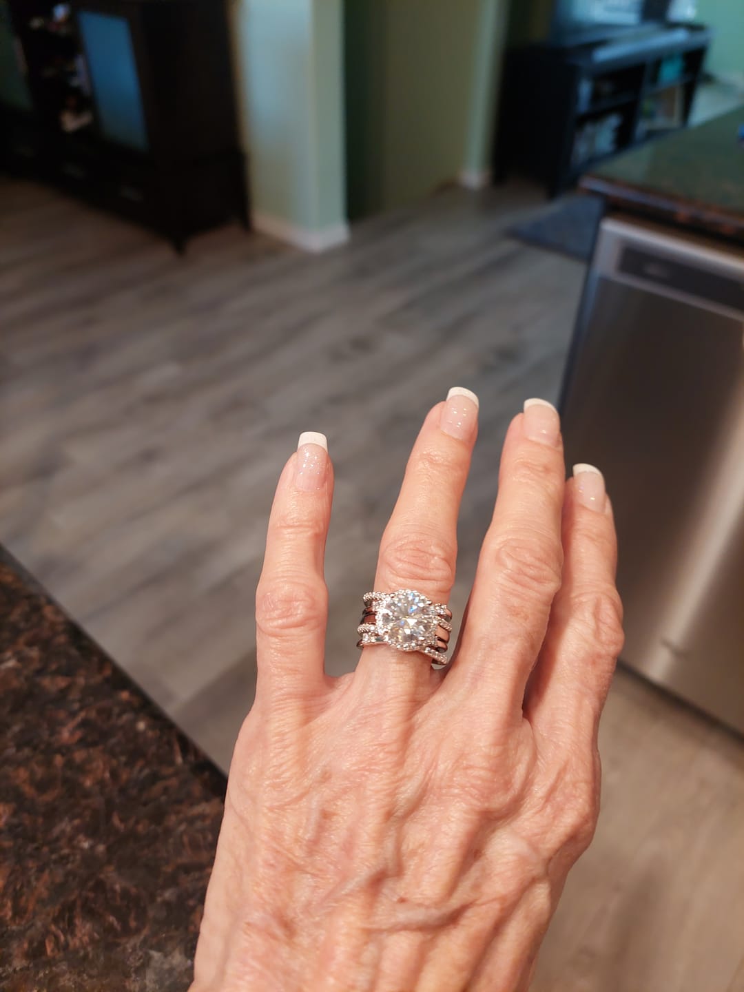 Customer photo review of Halo Moissanite With Enhancer Cross Shank Bridal Engagement Ring Set