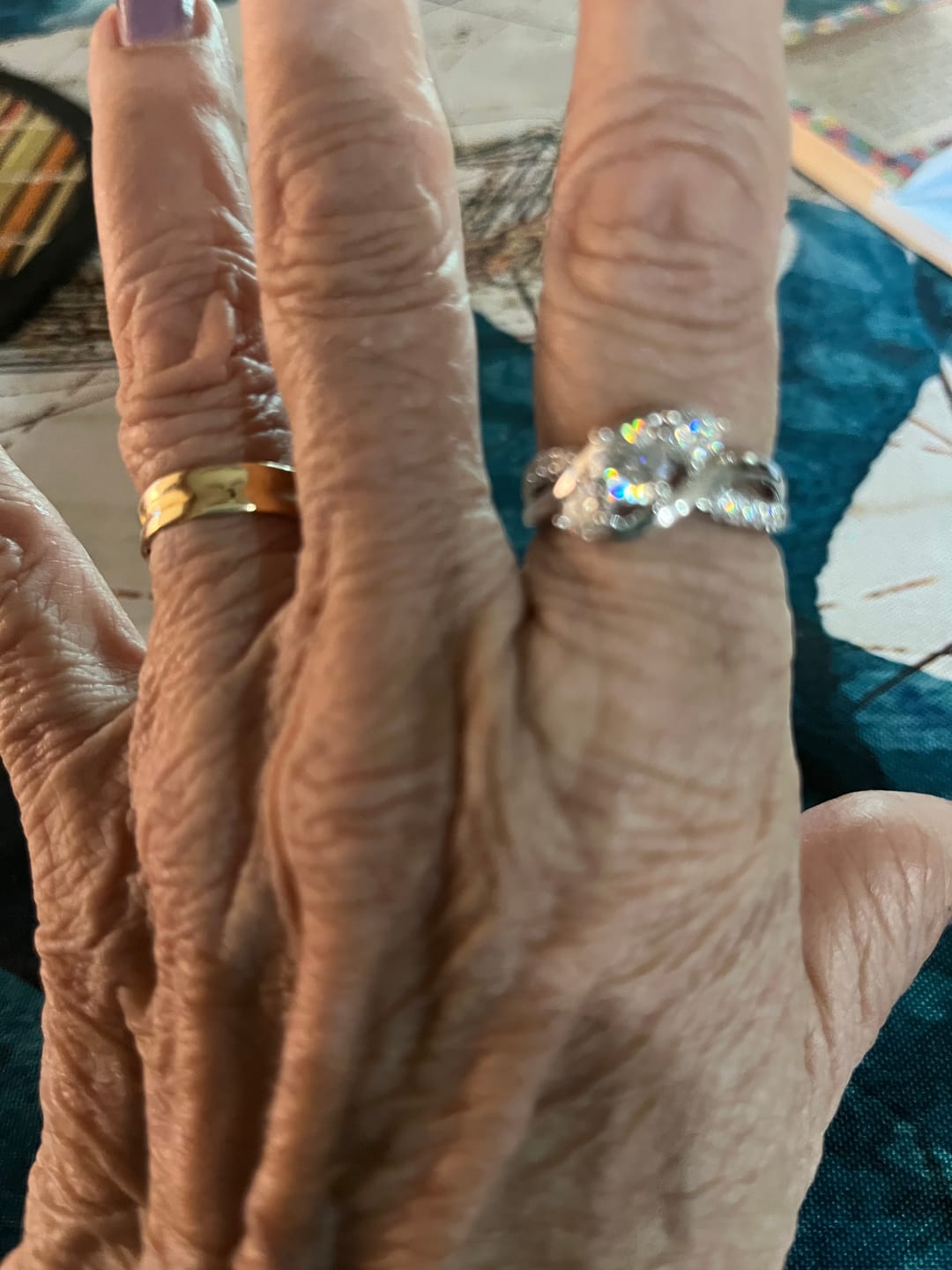 Customer photo review of Swirl Three Stone Moissanite Twisted Pave Engagement Ring