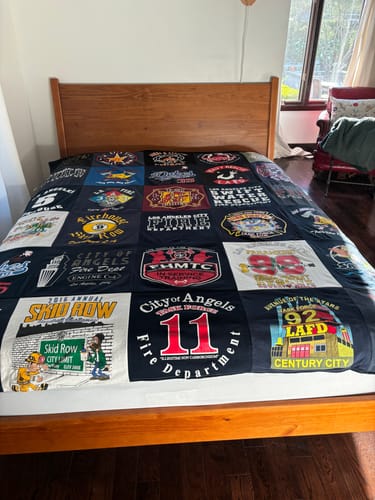 T-shirt quilt with firefighting, sports themes by Jeannie from CA