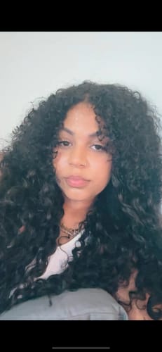 Customer photo review of Natural Black Curly Clip-In Hair Extensions