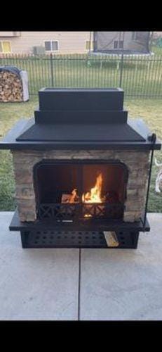 Customer photo review of SUNJOY Outdoor 48 Inch Black Steel Wood Burning Stone Fireplace with Fire Poker and Removable Grate