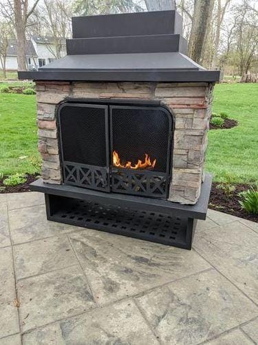 Customer photo review of SUNJOY Outdoor 48 Inch Black Steel Wood Burning Stone Fireplace with Fire Poker and Removable Grate