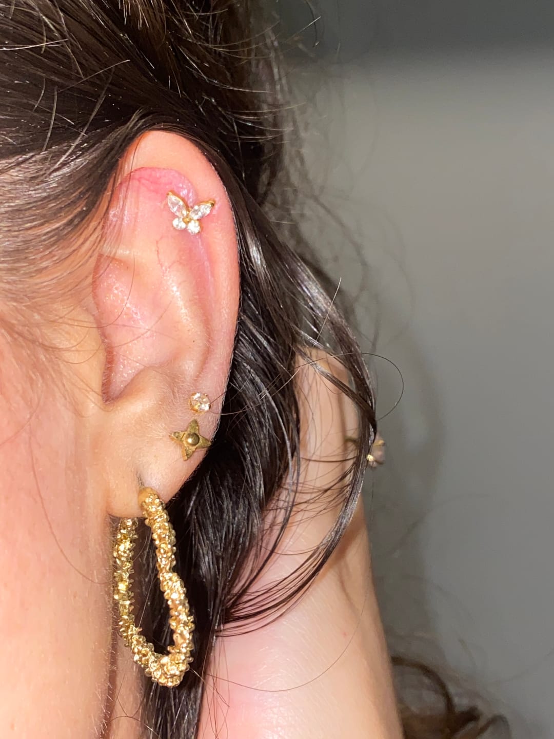Customer photo review of Butterfly Piercing | Titan