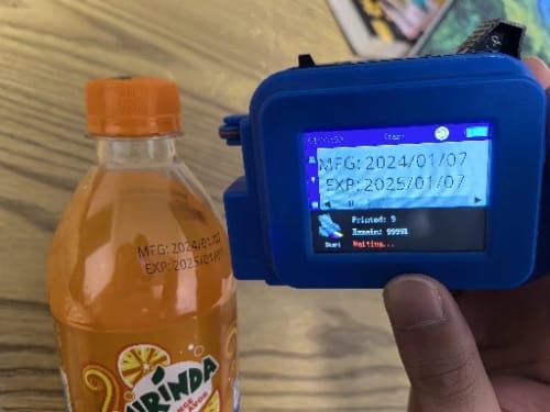 Customer photo review of Mini PrintPeak Handheld Inkjet Printer - Perfect for Curved Surfaces