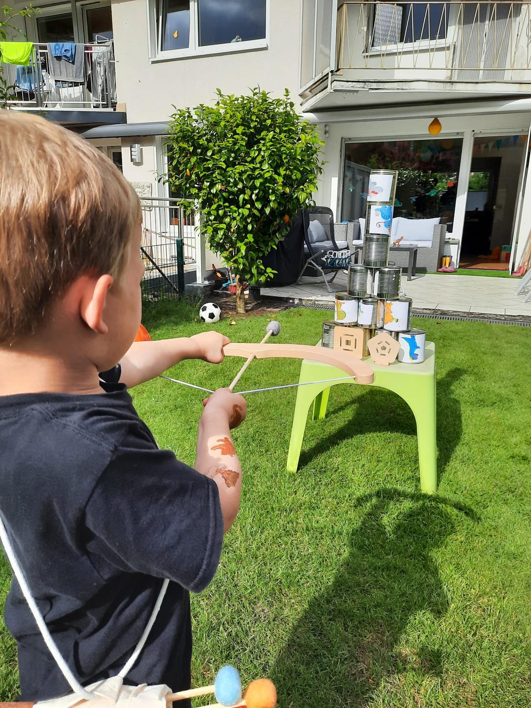Customer photo review of Pfeil und Bogen Kinder Holzspielzeug mit 5 Pfeilen, Köcher und 4 Zielscheiben