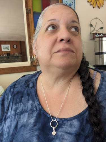 Customer photo review of Sterling Silver Hawaiian Scroll Heart in Circle Pendant (Chain Sold Separately)