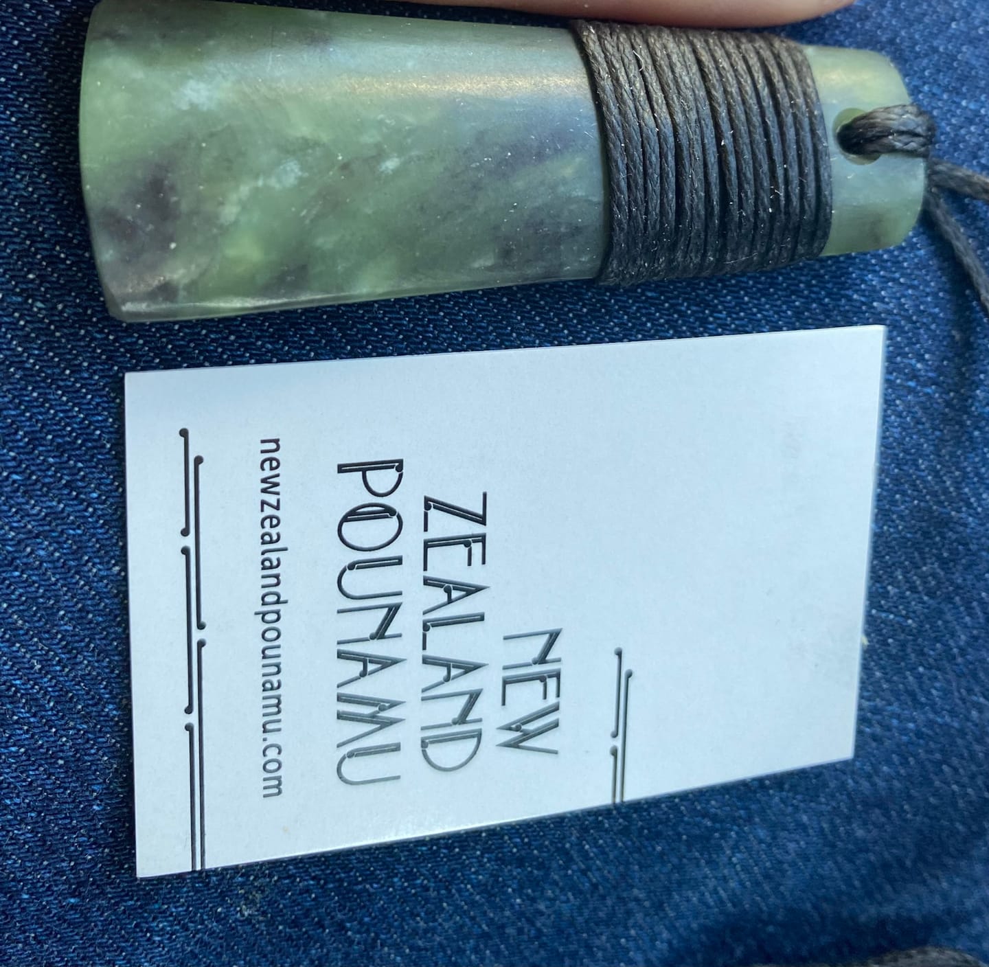 Customer photo review of Genuine Ngai Tahu Pounamu Wrapped Greenstone Toki Necklace 6cm