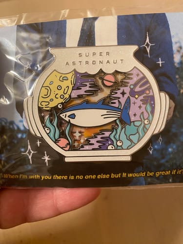 Customer photo review of BTS Jin Super Tuna x Astronaut Enamel Pins