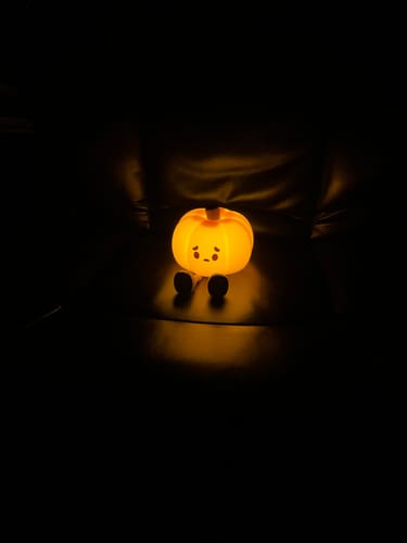 Customer photo review of UNEEDE LED Cute Pumpkins Night Light, Cute Halloween Silicone Nursery Night Light Rechargeable Table Lamp Bedside Lamp with Touch Sensor for Bedrooms, Living Room
