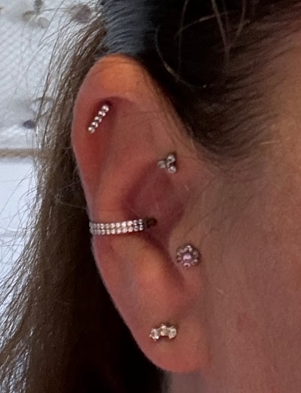 Customer photo review of Double Conch Piercing | Titan