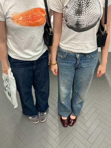 Customer photo review of 'Papaya' baby tee