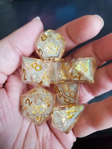 Customer photo review of URWizards D&D Starry Liquid Heart Resin Engraved Dice Set Tarot