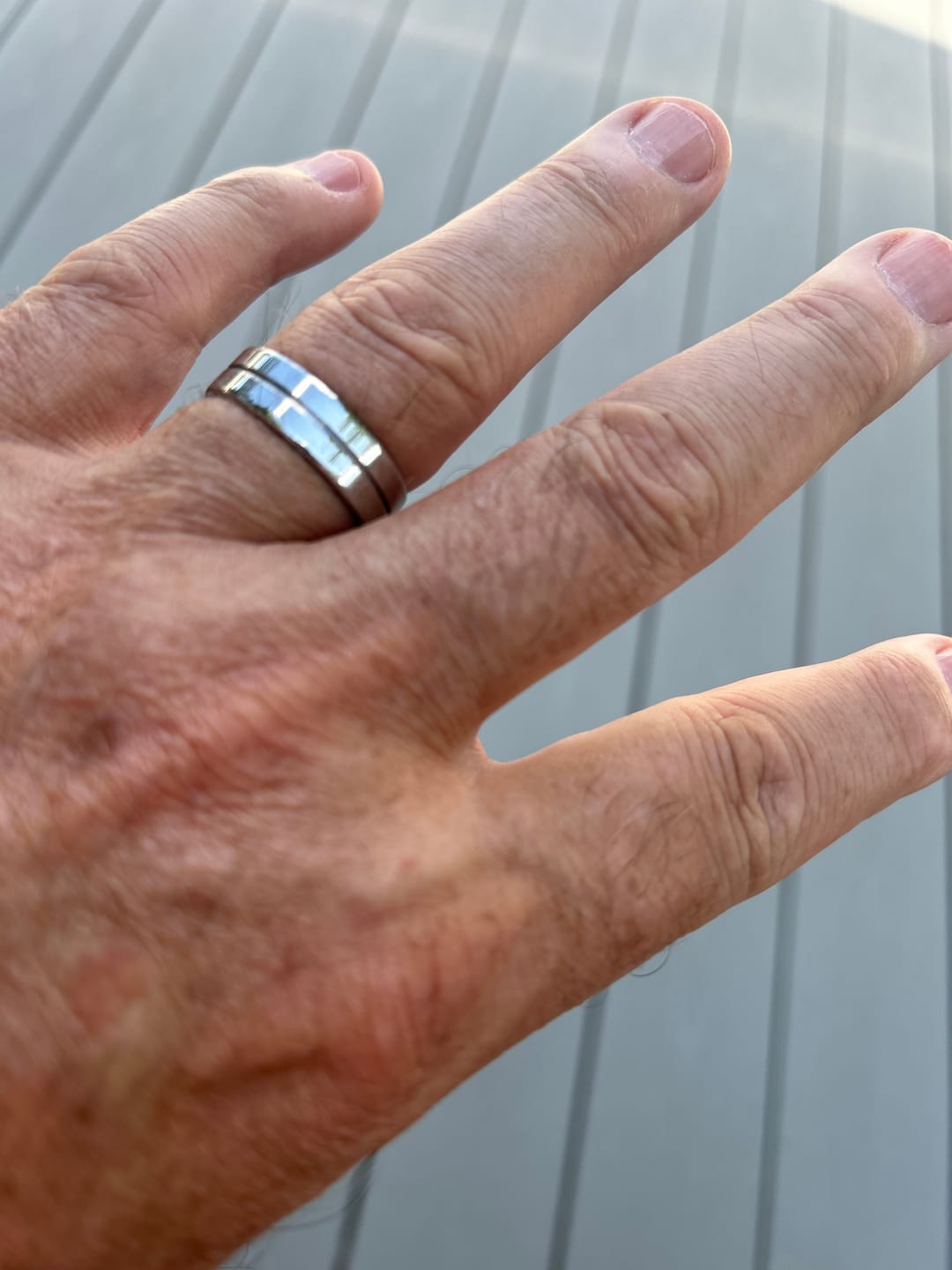 Customer photo review of His and Hers Matching Titanium Ring Set