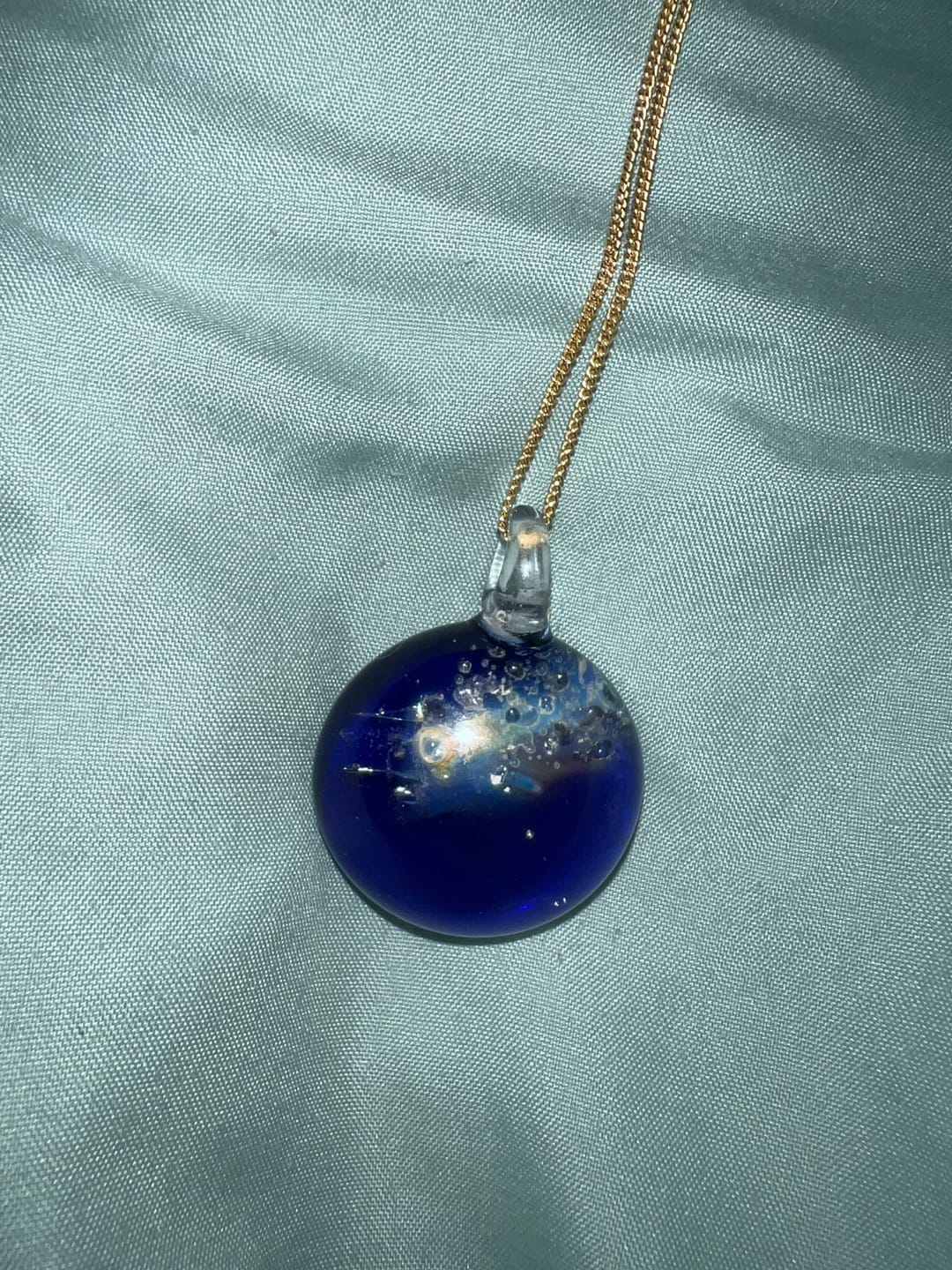 Customer photo review of Halley's Comet Glass Pendant