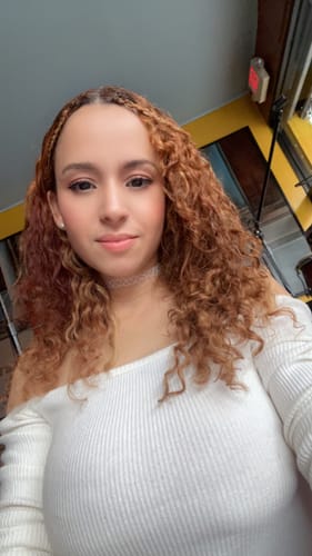 Customer photo review of Strawberry Blonde Curly Clip-In Hair Extensions