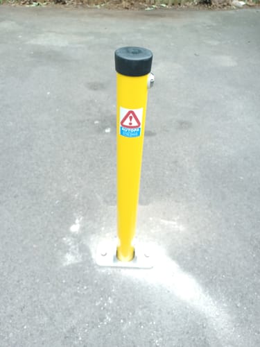 Customer photo review of Yellow Hinged Fold Down Parking Post