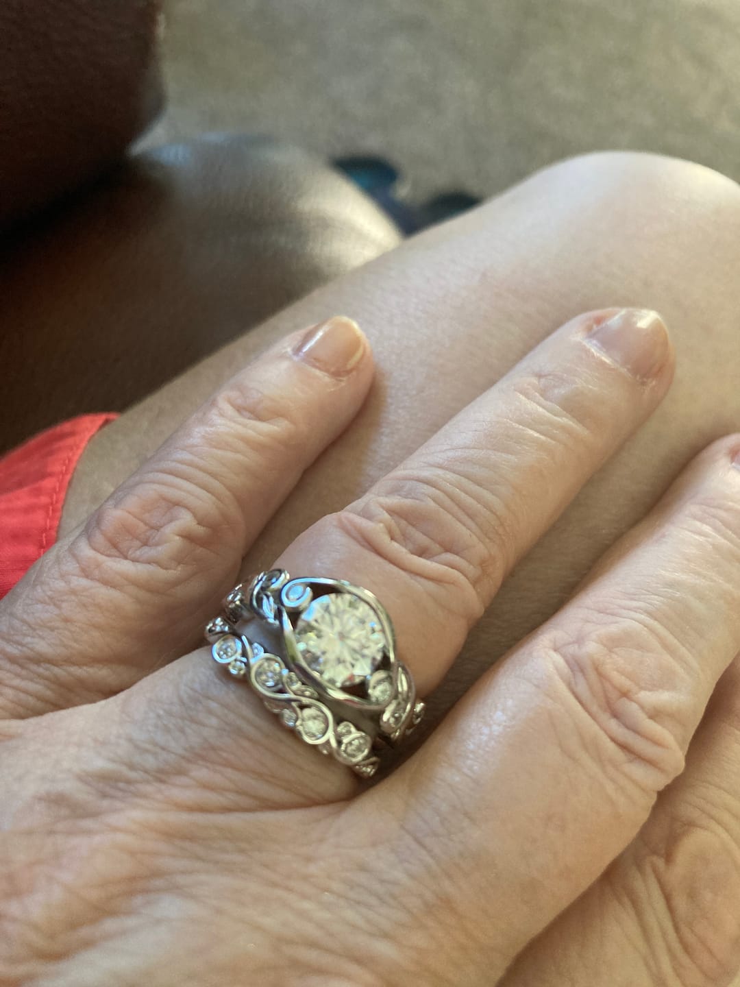 Customer photo review of Bezel Set Round Moissanite Scroll Accents Engagement Ring