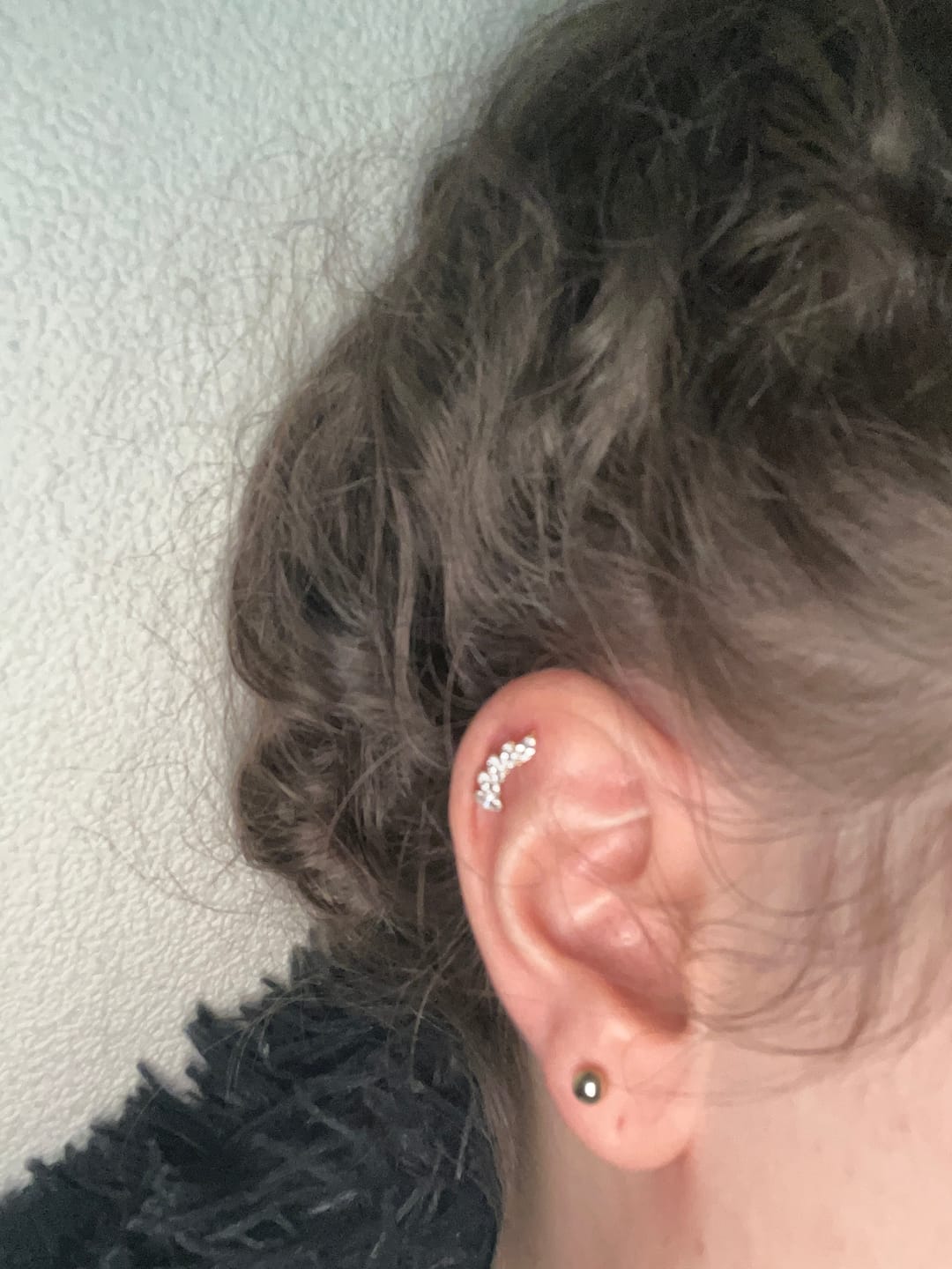 Customer photo review of Feather Piercing | Titan