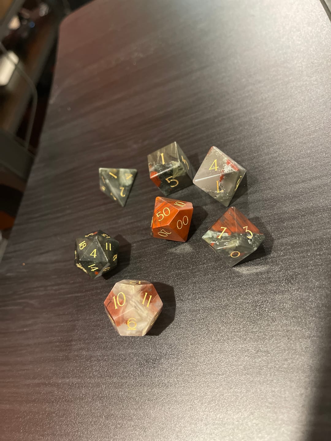 Customer photo review of URWizards D&D Bloodstone Engraved Dice Set Dragon Style