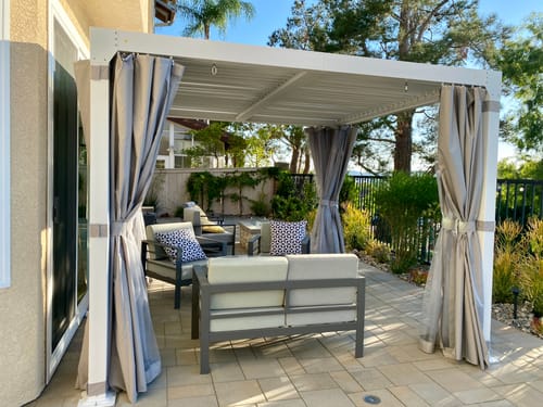 Customer photo review of EROMMY 10' x 10' Outdoor Louvered Pergola, Patio Hardtop Gazebo for Garden Yard, Curtains and Netting Included, White