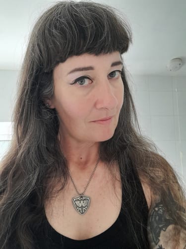 Customer photo review of Waylon Jennings Guitar Pick Necklace