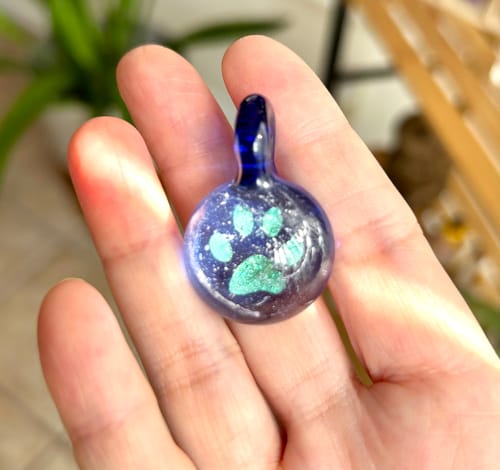 Customer photo review of Pawprint Foil Pendant with Cremation Ash